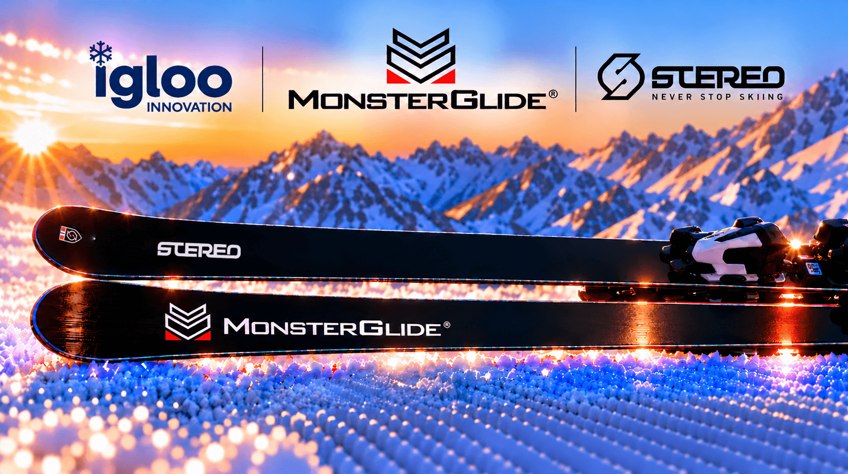 MonsterGlide and Stereo skis on snow in front of a mountain landscape.